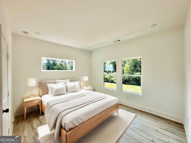 bedroom with light hardwood / wood-style flooring