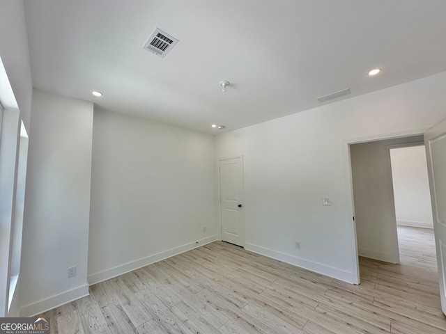 empty room with light hardwood / wood-style floors