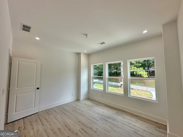 unfurnished room featuring light hardwood / wood-style flooring