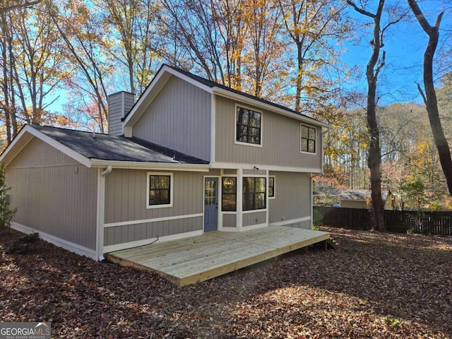 back of property featuring a wooden deck