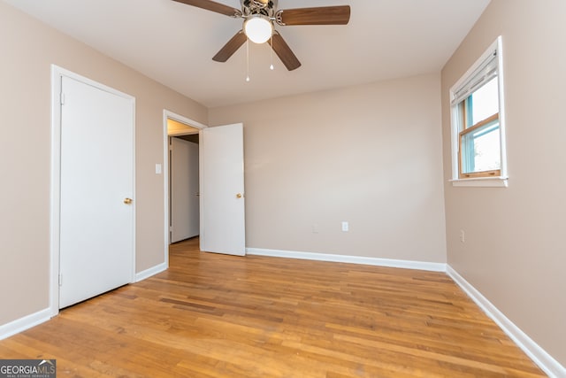 unfurnished bedroom with light wood-type flooring and ceiling fan