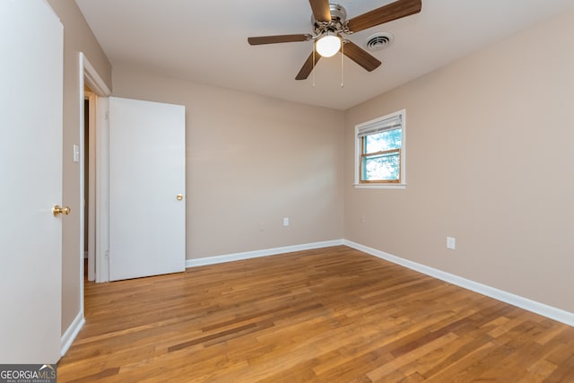 unfurnished room featuring ceiling fan and light hardwood / wood-style flooring