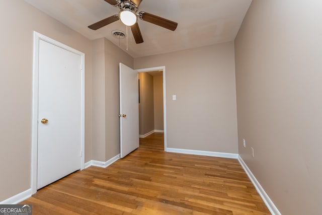 unfurnished bedroom featuring ceiling fan and light hardwood / wood-style floors