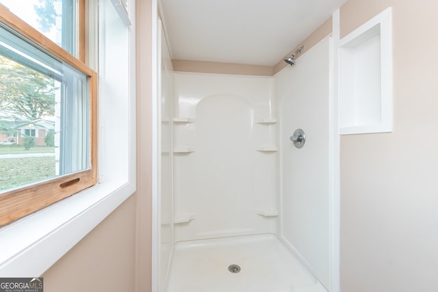 bathroom featuring walk in shower