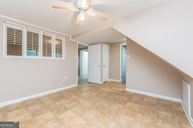 bonus room featuring ceiling fan