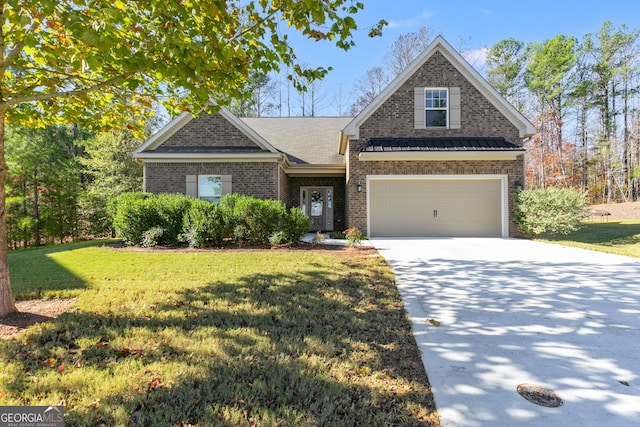 view of front of property with a garage and a front lawn