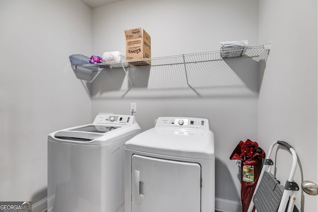 washroom with washing machine and dryer