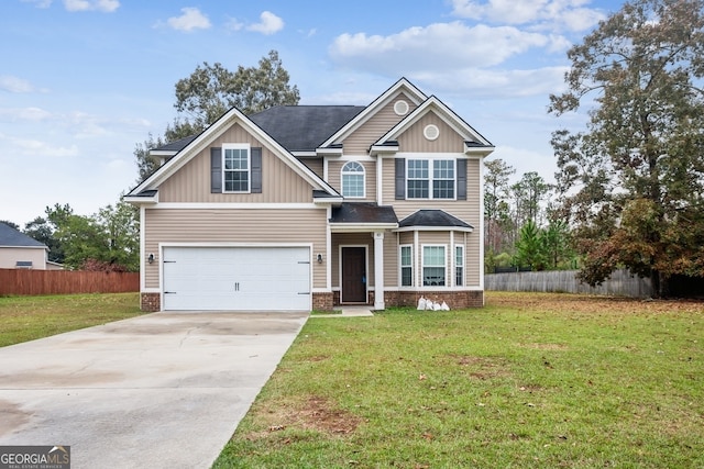 view of front of home featuring a front lawn and a garage