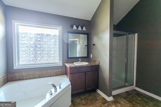 bathroom featuring separate shower and tub, vanity, and lofted ceiling