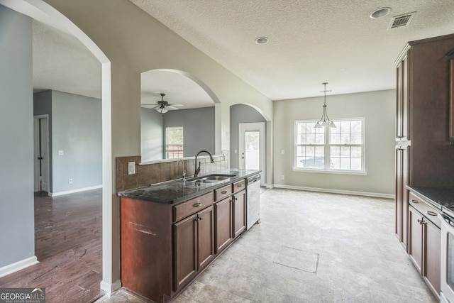 kitchen featuring stainless steel appliances, ceiling fan, a healthy amount of sunlight, and sink