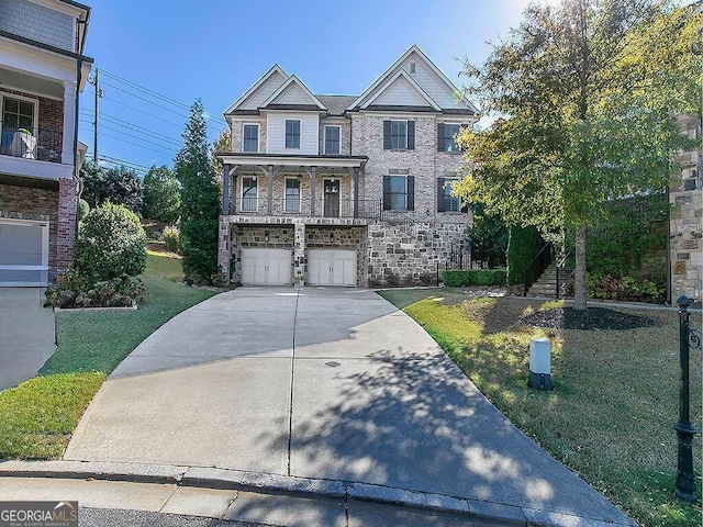 view of front of home featuring a garage and a front yard