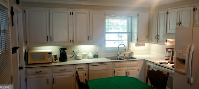 kitchen featuring white cabinetry, white appliances, and sink