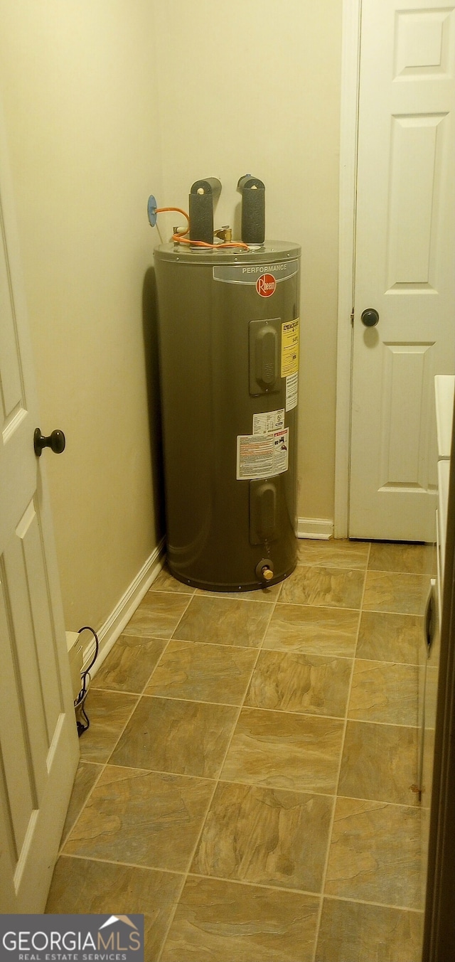 utility room with electric water heater