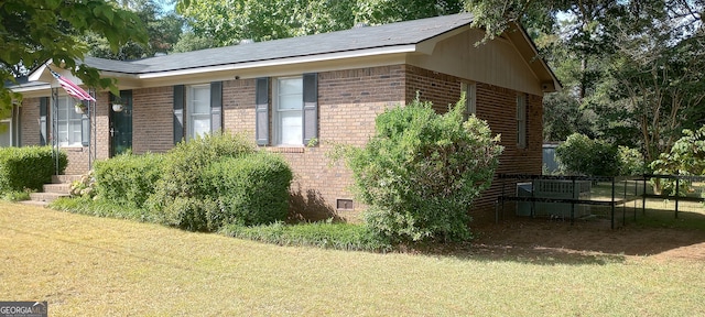 view of property exterior with a yard