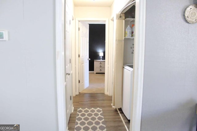 corridor featuring washer / clothes dryer and hardwood / wood-style floors