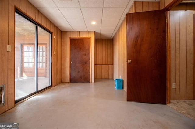 spare room with wooden walls