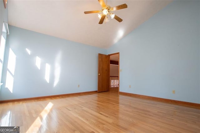 unfurnished room featuring high vaulted ceiling, light hardwood / wood-style flooring, and ceiling fan