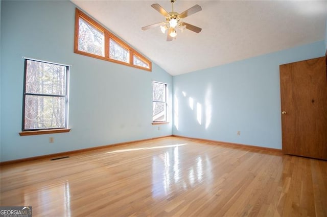 interior space featuring ceiling fan, light hardwood / wood-style floors, and high vaulted ceiling