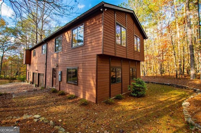 view of property exterior with a garage