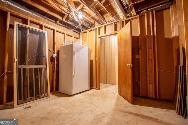 basement with white fridge