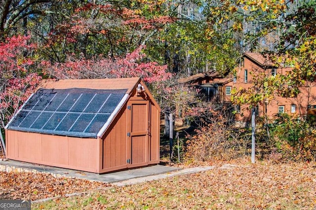 view of outdoor structure featuring solar panels