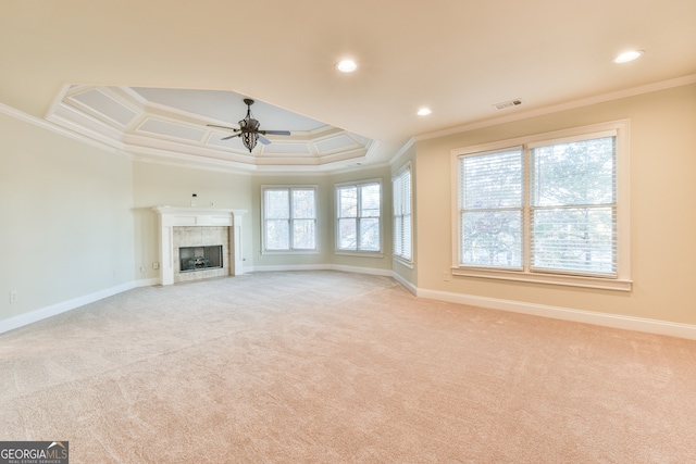 unfurnished living room featuring light colored carpet, ceiling fan, and ornamental molding