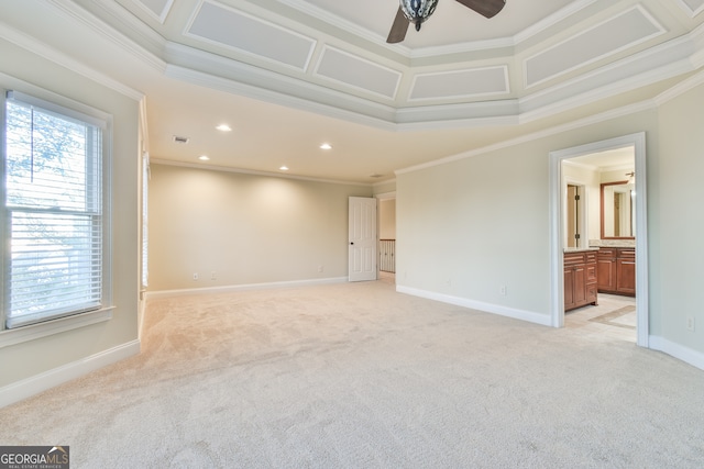 carpeted empty room featuring ceiling fan and crown molding