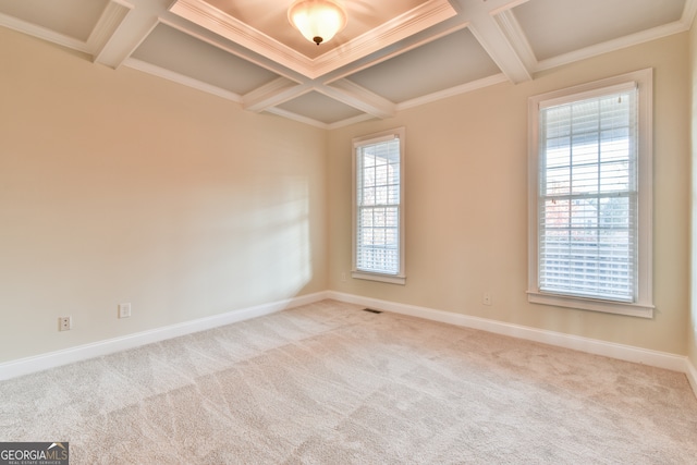 carpeted spare room featuring beam ceiling, crown molding, and coffered ceiling