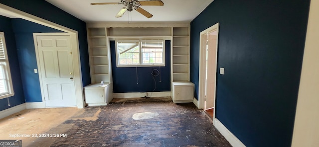 interior space featuring ceiling fan