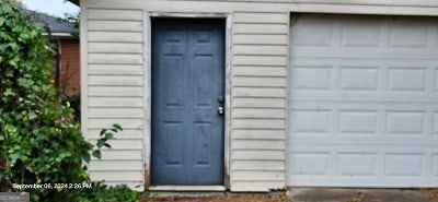 view of outdoor structure with a garage