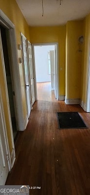 corridor featuring hardwood / wood-style flooring