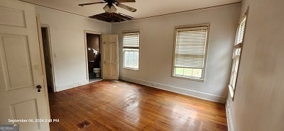 unfurnished bedroom featuring wood-type flooring and ceiling fan