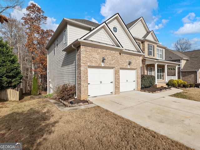 view of front of house featuring a porch and a garage