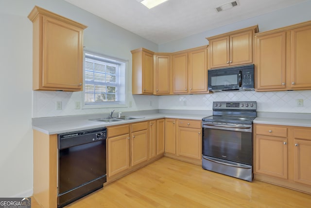 kitchen with sink, tasteful backsplash, black appliances, light hardwood / wood-style floors, and light brown cabinets