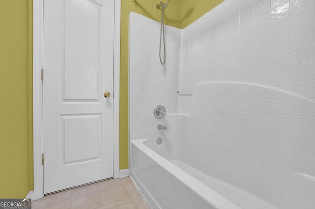 bathroom with tile patterned floors and bathtub / shower combination