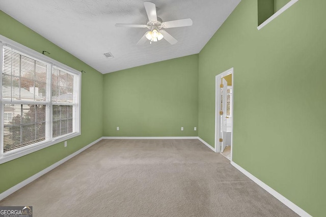 unfurnished room featuring ceiling fan and light carpet