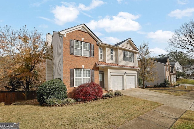 view of front of home with a garage and a front yard