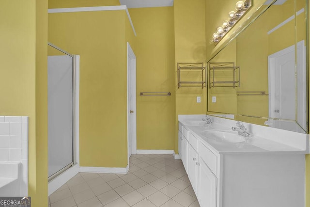 bathroom featuring tile patterned flooring, vanity, and a shower with shower door