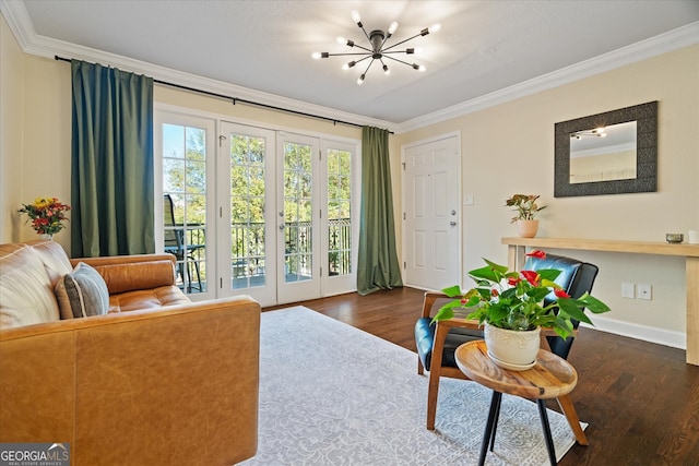 living room featuring a notable chandelier, dark hardwood / wood-style floors, and crown molding