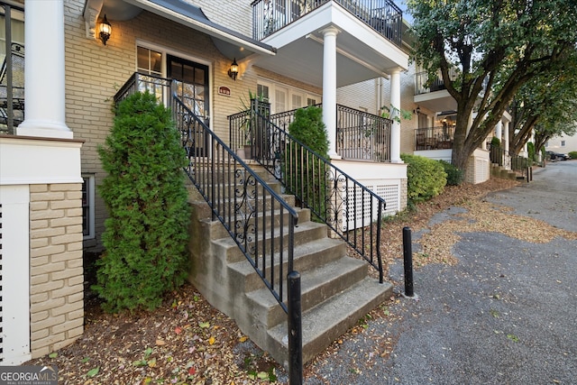 view of exterior entry featuring a porch