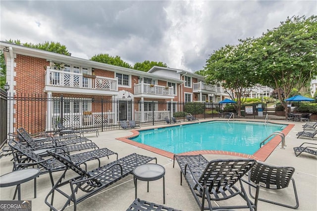 view of pool featuring a patio