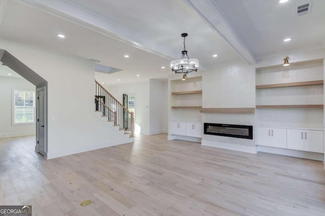 unfurnished living room featuring beamed ceiling, a chandelier, and light hardwood / wood-style flooring