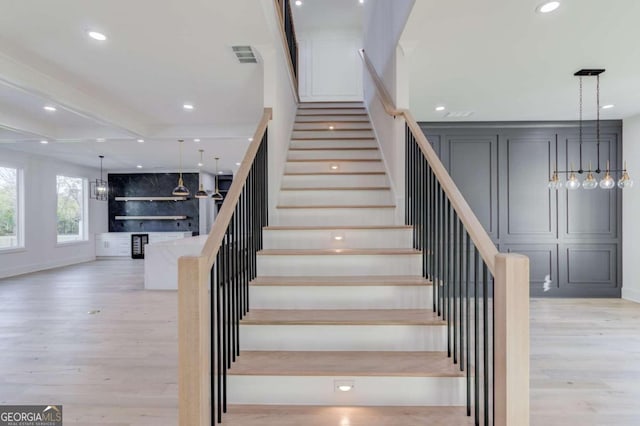 stairs featuring hardwood / wood-style flooring