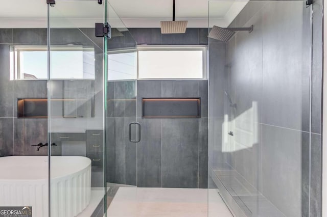 bathroom featuring tile patterned floors and walk in shower