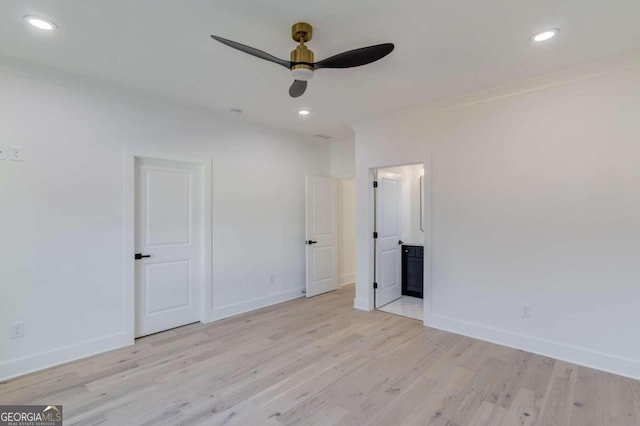 unfurnished bedroom with ceiling fan, light wood-type flooring, ornamental molding, and ensuite bath