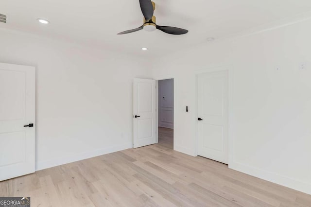 unfurnished room featuring ceiling fan and light hardwood / wood-style flooring