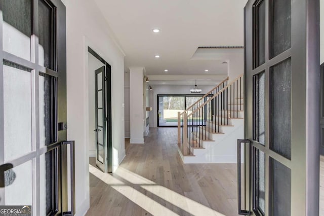 entryway featuring french doors and light hardwood / wood-style floors