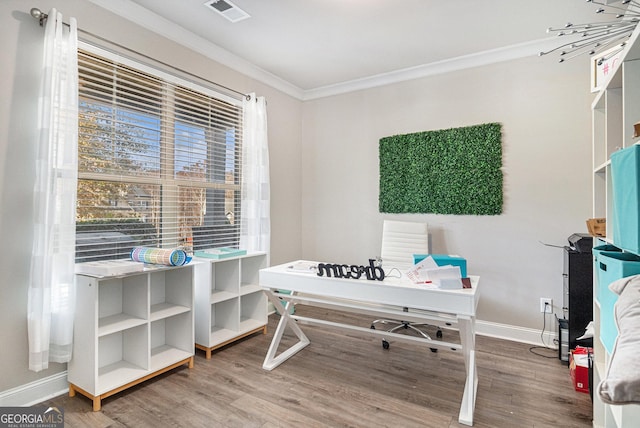 office with wood-type flooring and ornamental molding