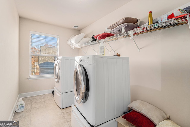 laundry room with washing machine and clothes dryer