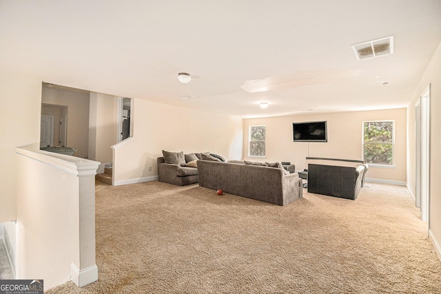 living room featuring light carpet